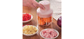 Rechargeable Mini Electric Vegetable & Garlic Chopper – hero shot chopping vegetables