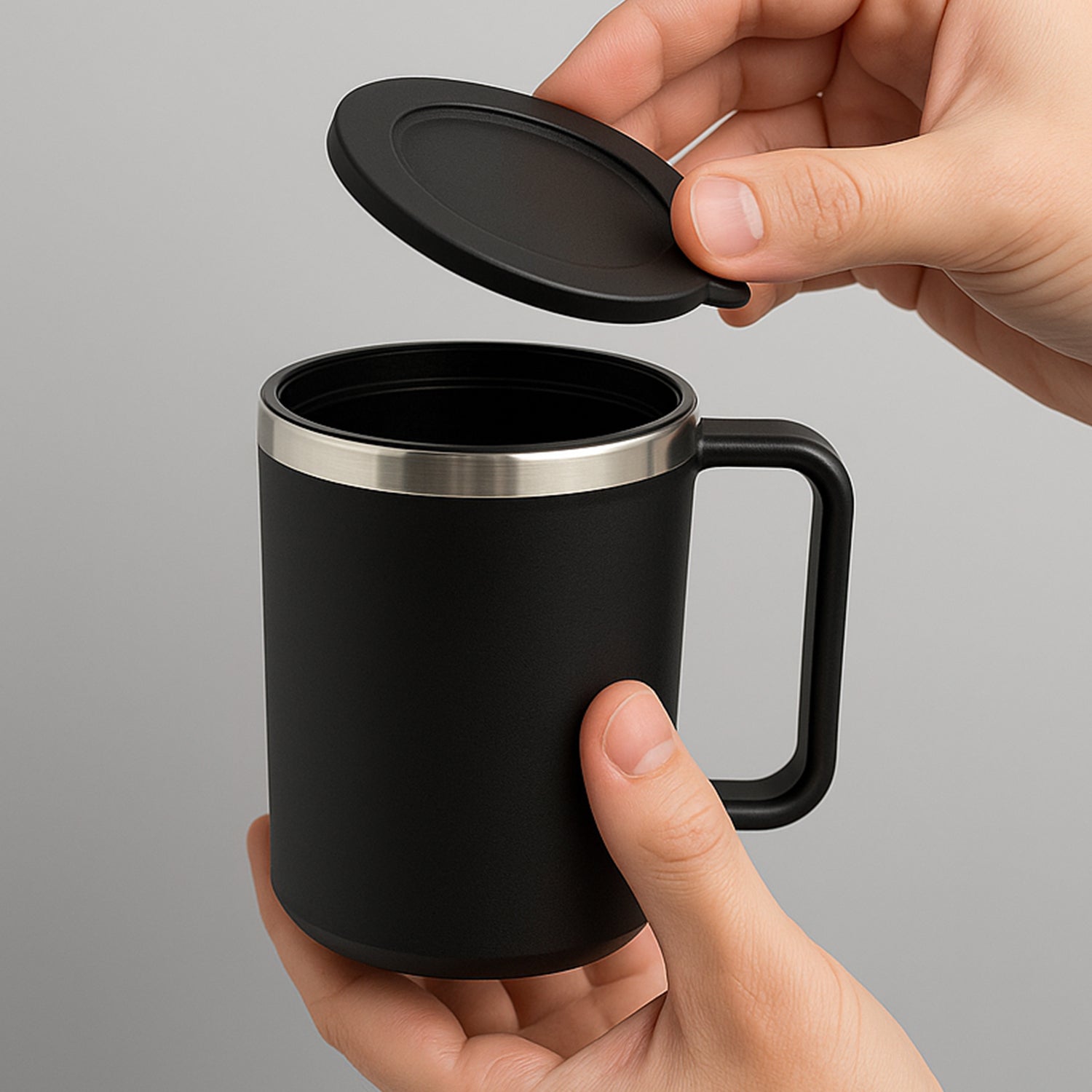 Insulated mug filled with hot coffee on a work desk